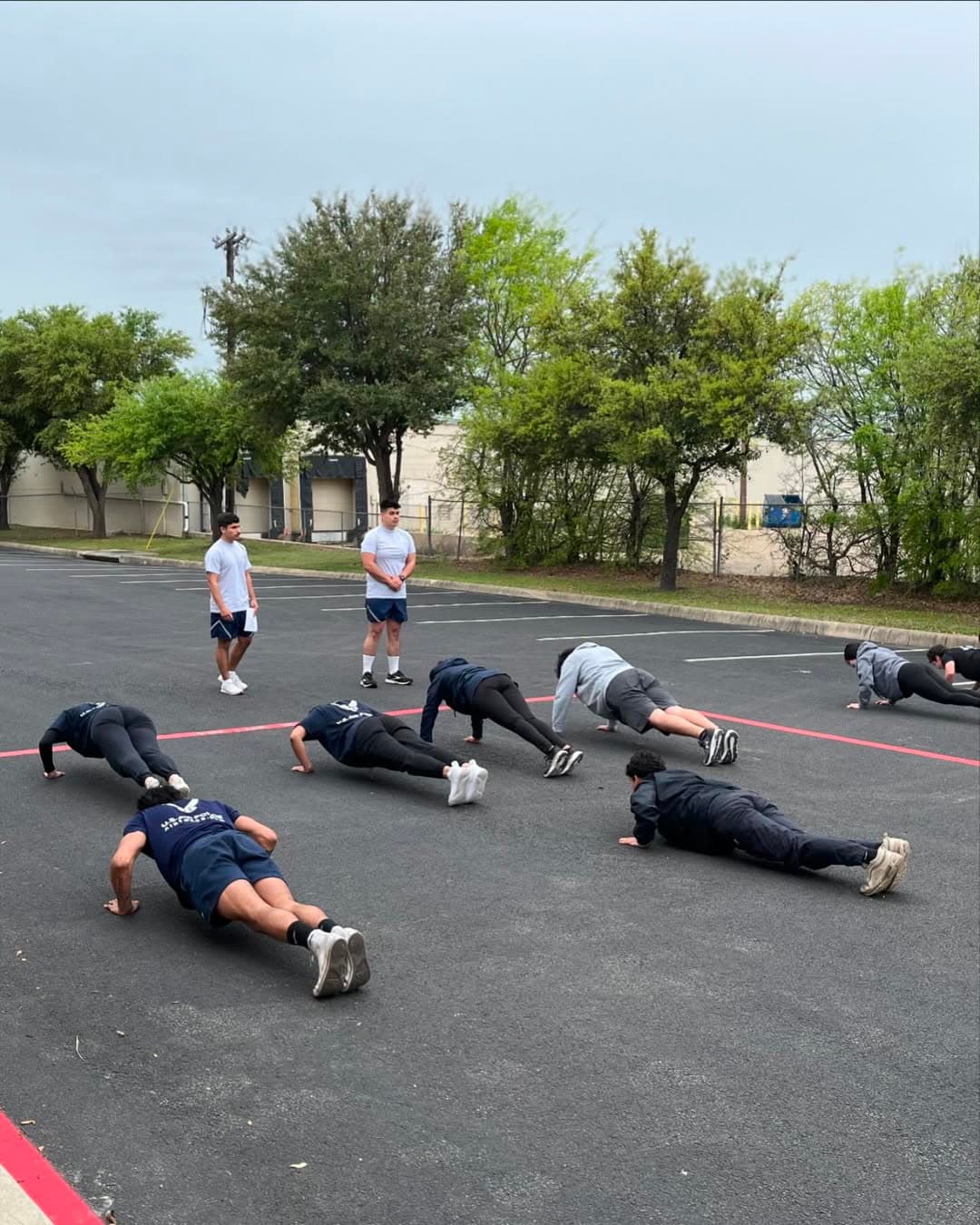Air Force airmen performing push-ups during PT test