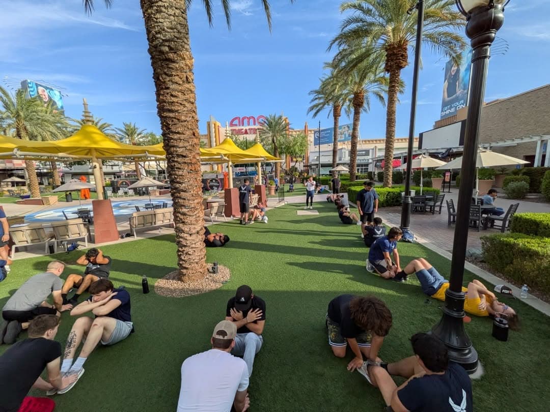 Group of Air Force trainees performing sit-ups during fitness assessment