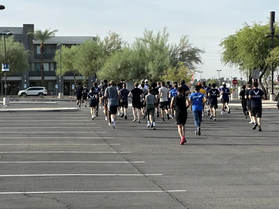 Air Force airmen running the 2-mile run event during PT test